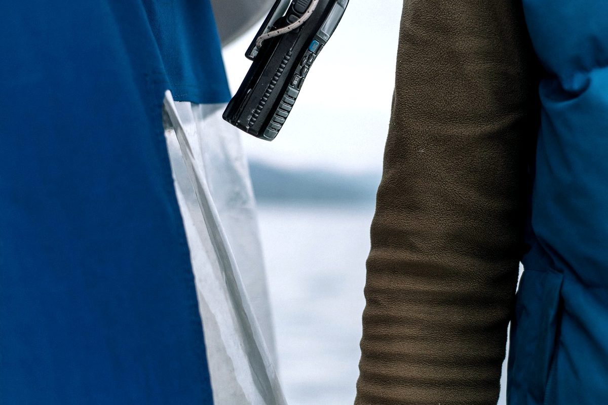 Handheld two-way radio carried in the field